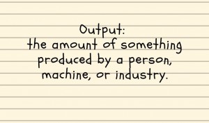 Handwritten note saying Output: the amount of something produced by a person, machine, or industry.