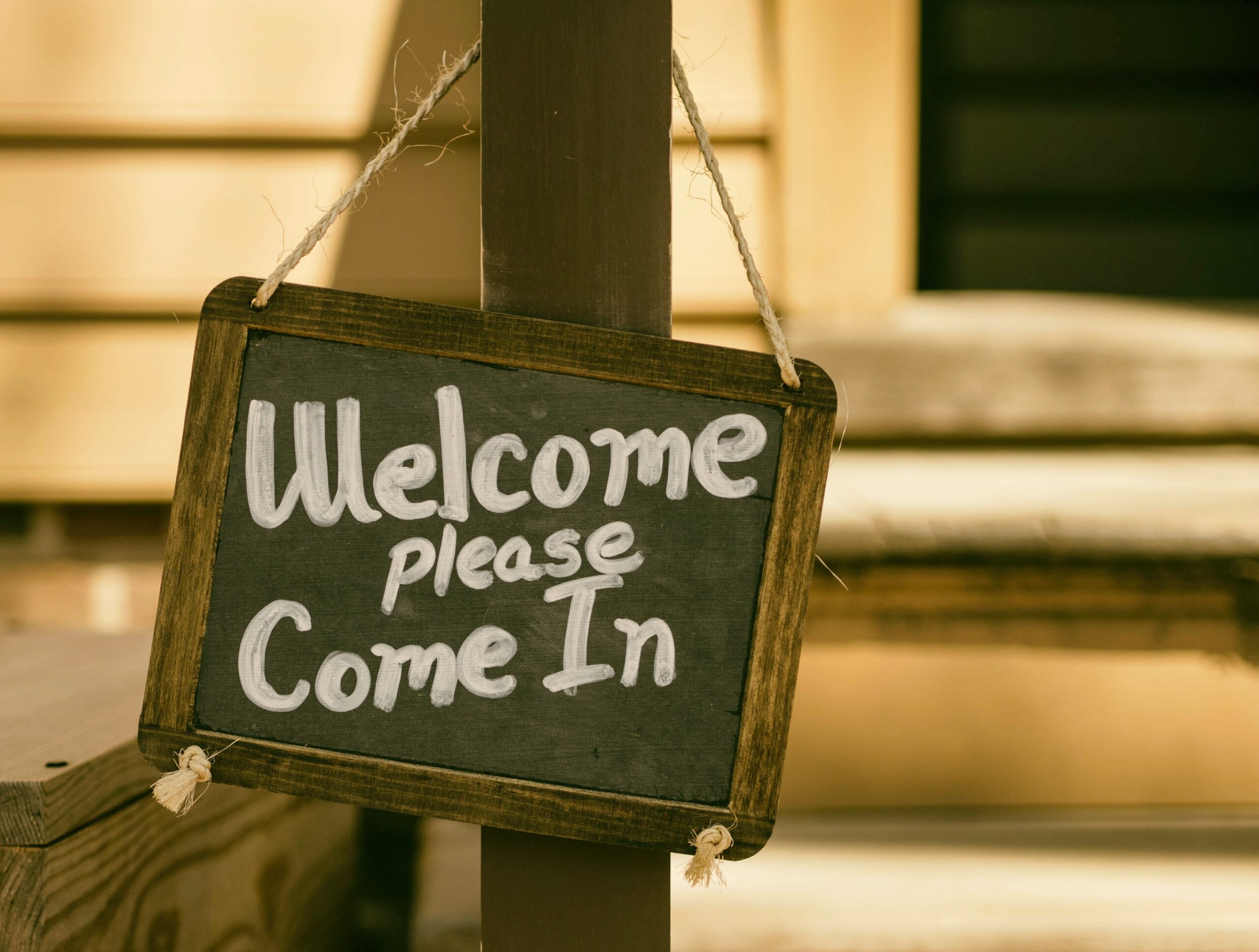 A chalkboard that reads Welcome, please come in