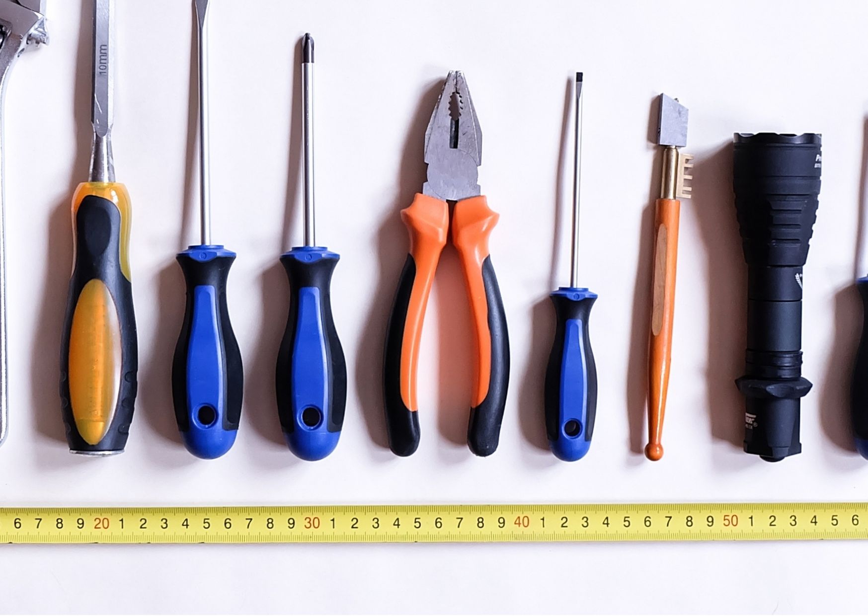 A row of tools, such as screw driver and pliers, ready to be put in a communication toolkit